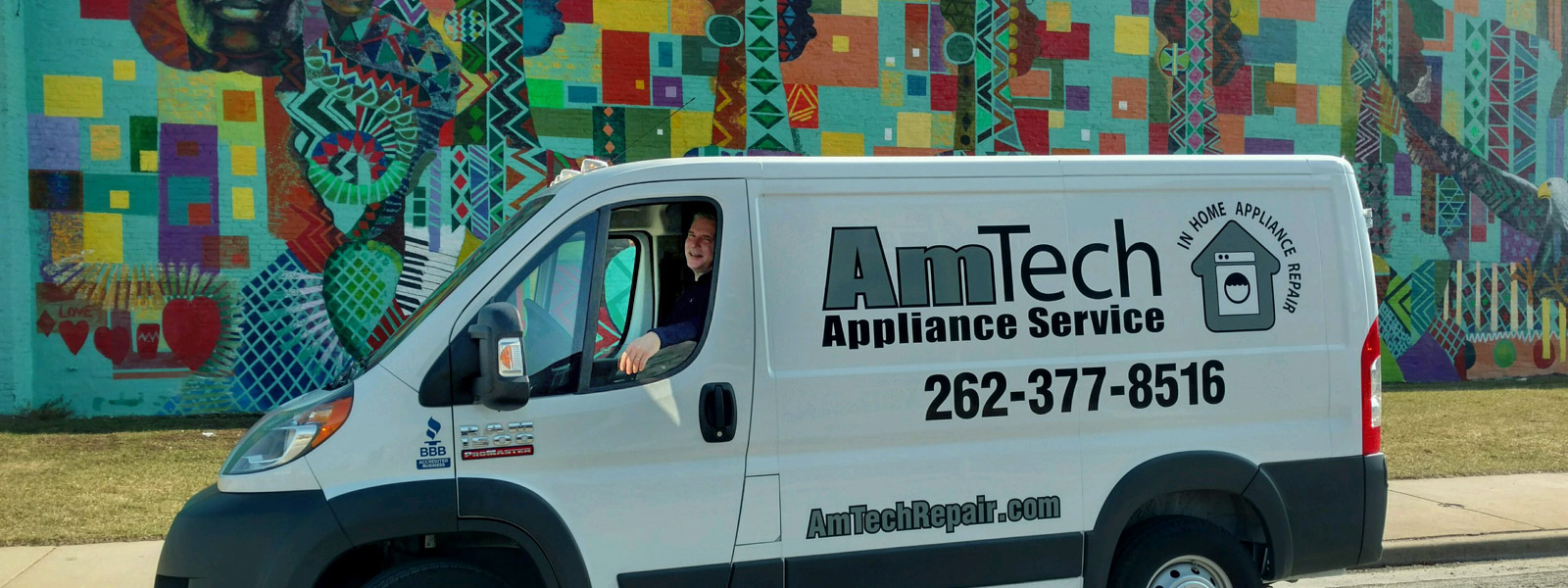 AmTech technician inside the company service van